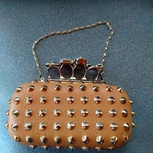 Brass knuckle studded clutch
